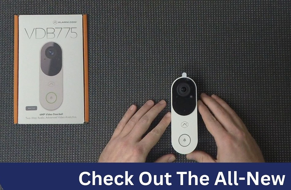 Alarm.com video doorbell held at a front door