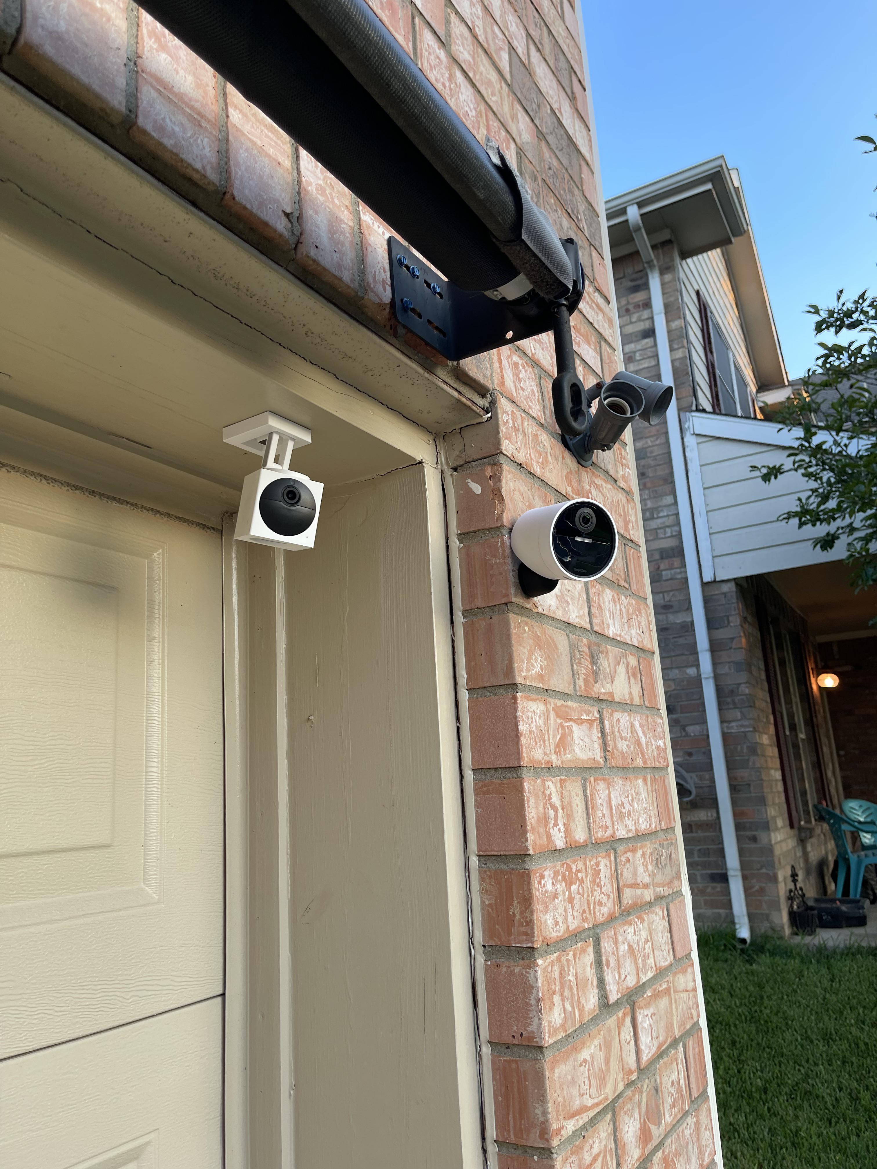 Outdoor security cameras protecting a home